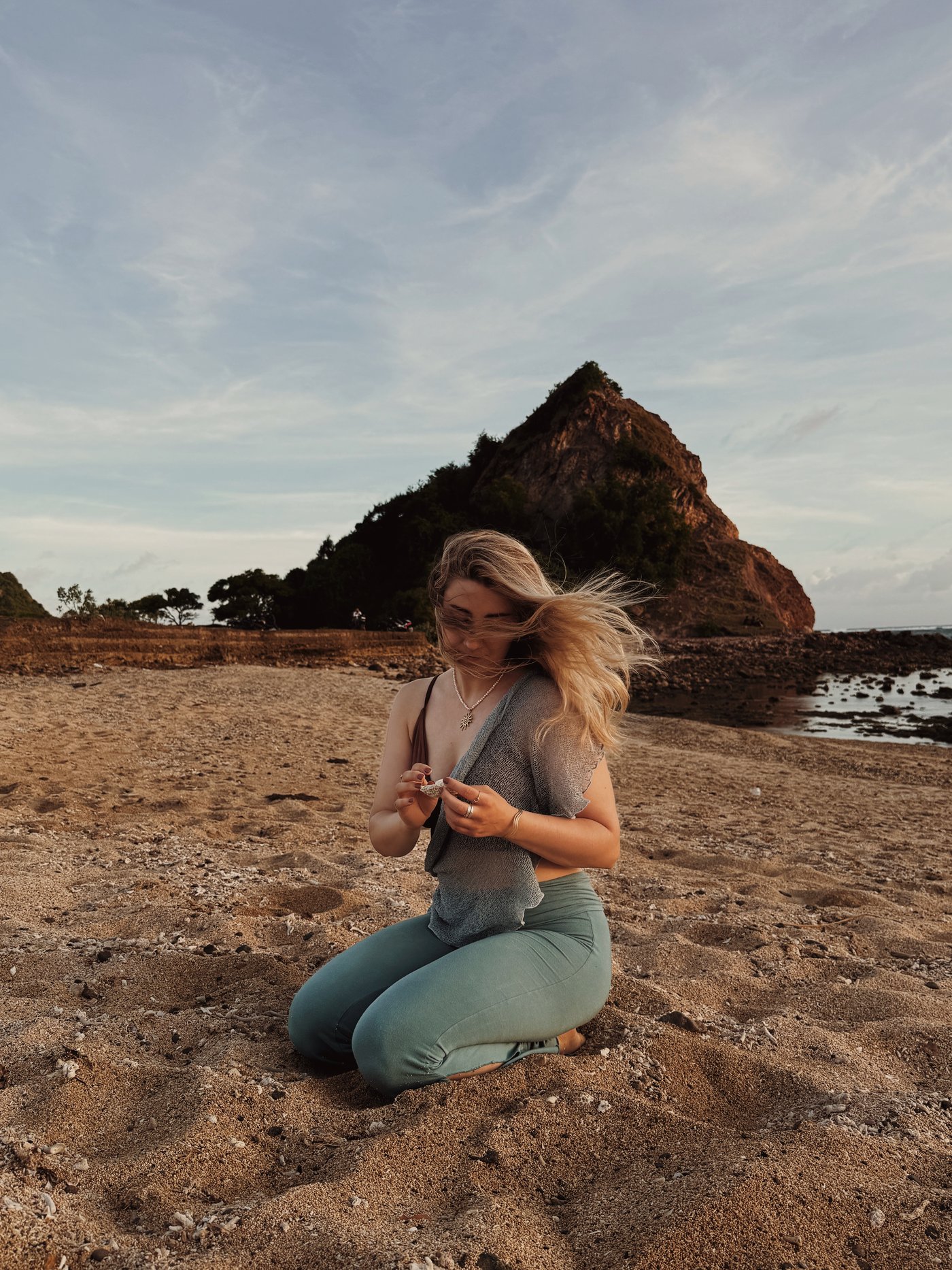 Anna in a candid, unposed moment outdoors, hair in the wind.